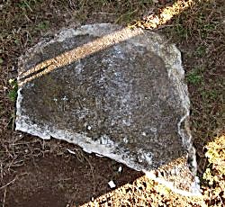 top of broken headstone
